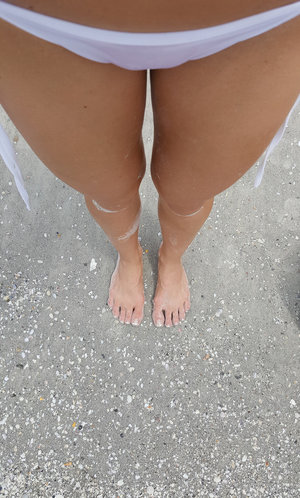 18 year old girl Katie Lewis stands naked after undressing in her bedroom